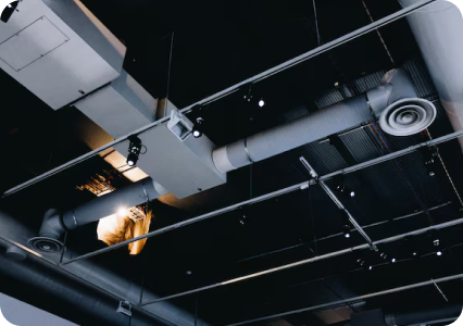 Exposed commercial HVAC ductwork and ceiling infrastructure inside a building